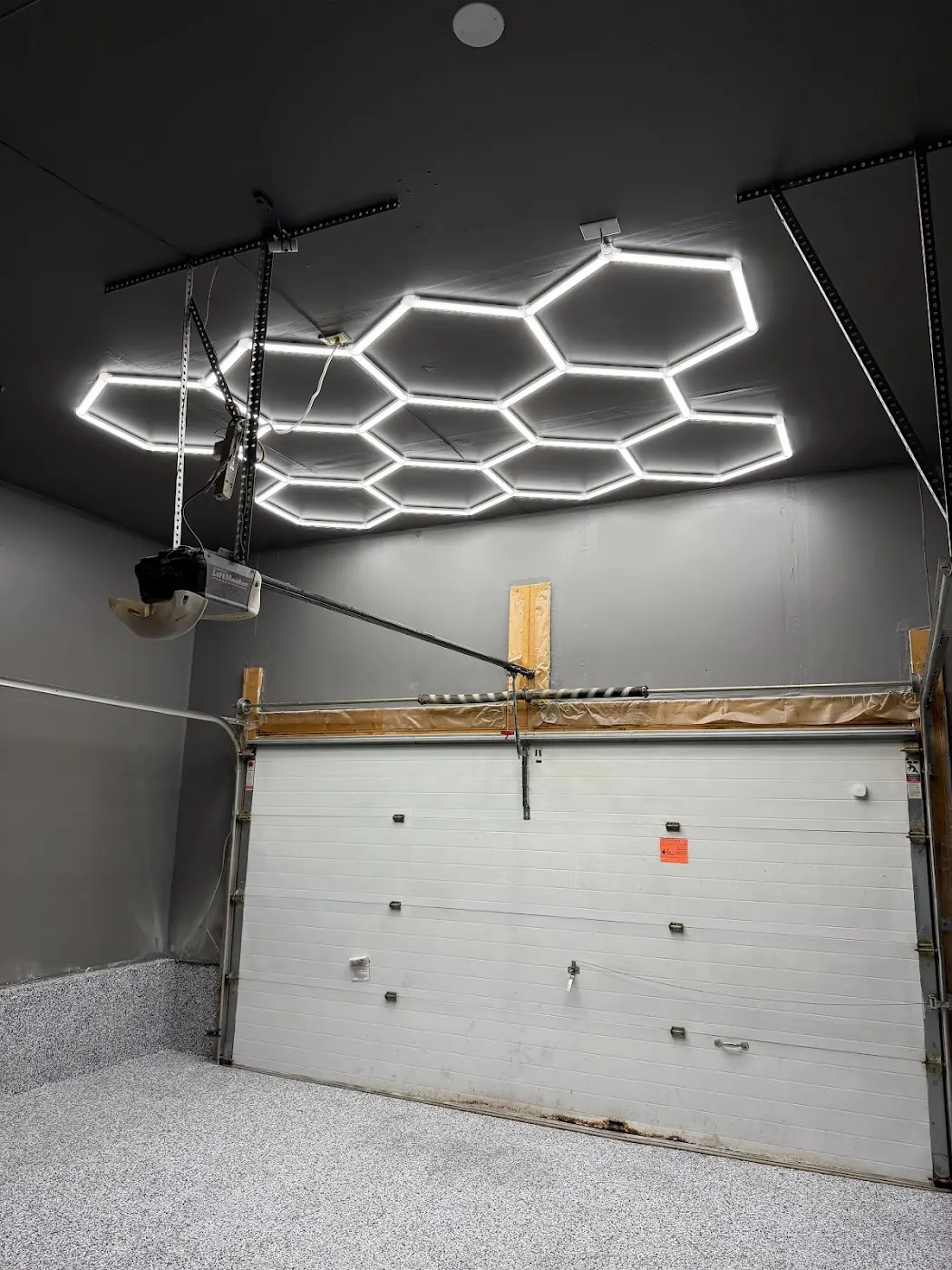 Hexagonal LED ceiling lights in a renovated garage